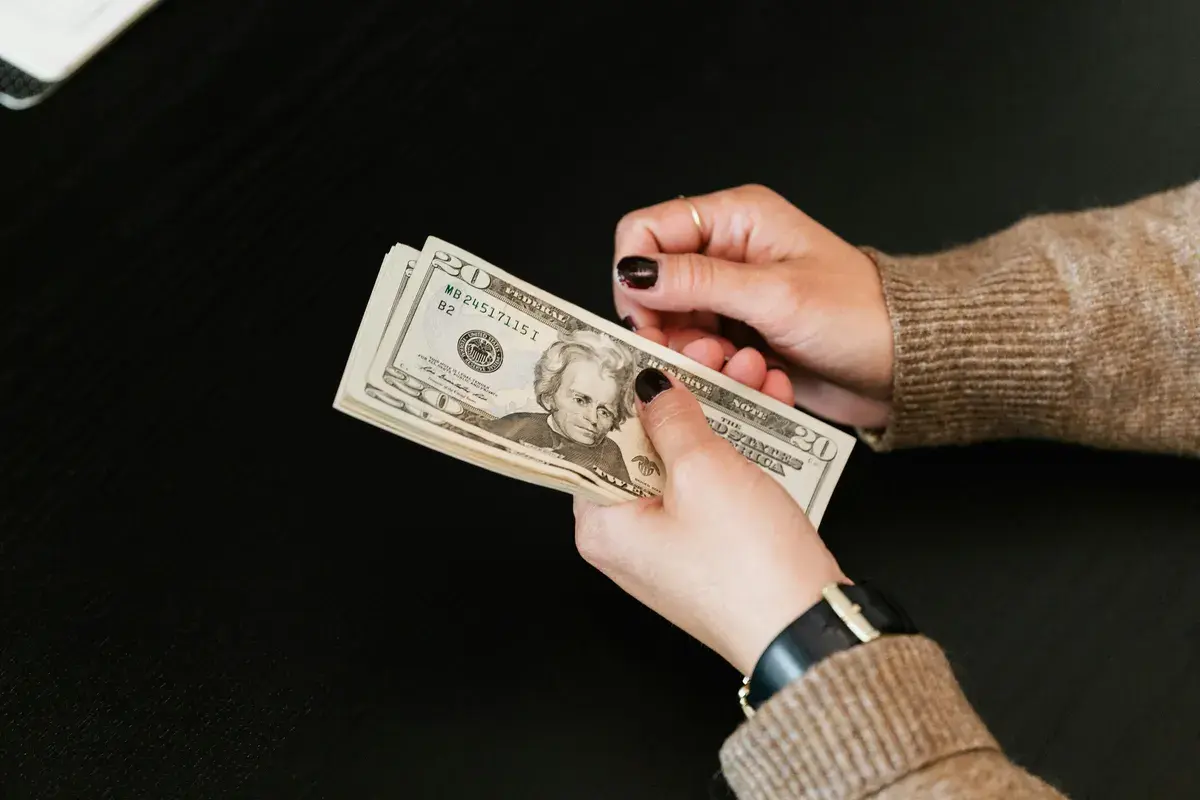 Homebuyer holding dollars