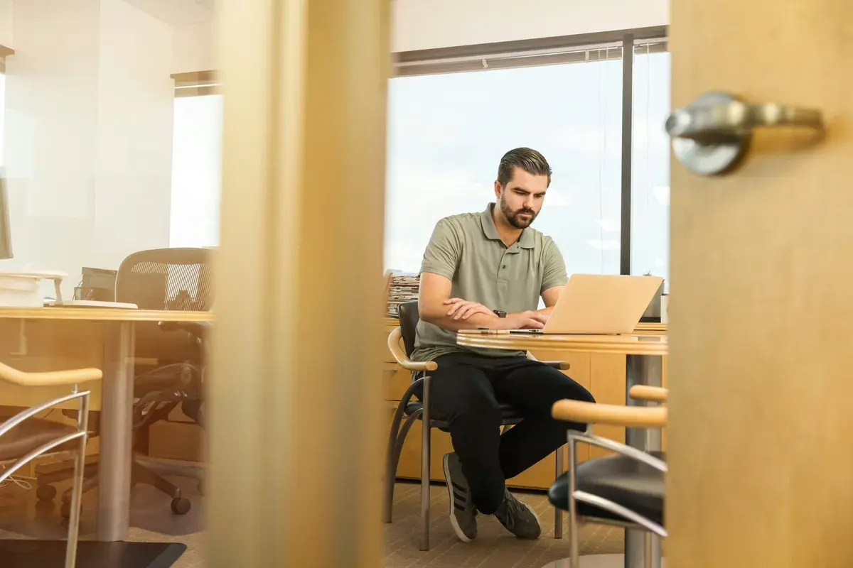 Mortgage broker offering Sunday services while sitting near desk