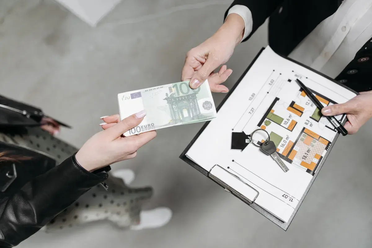 A client handing a payment to landlord