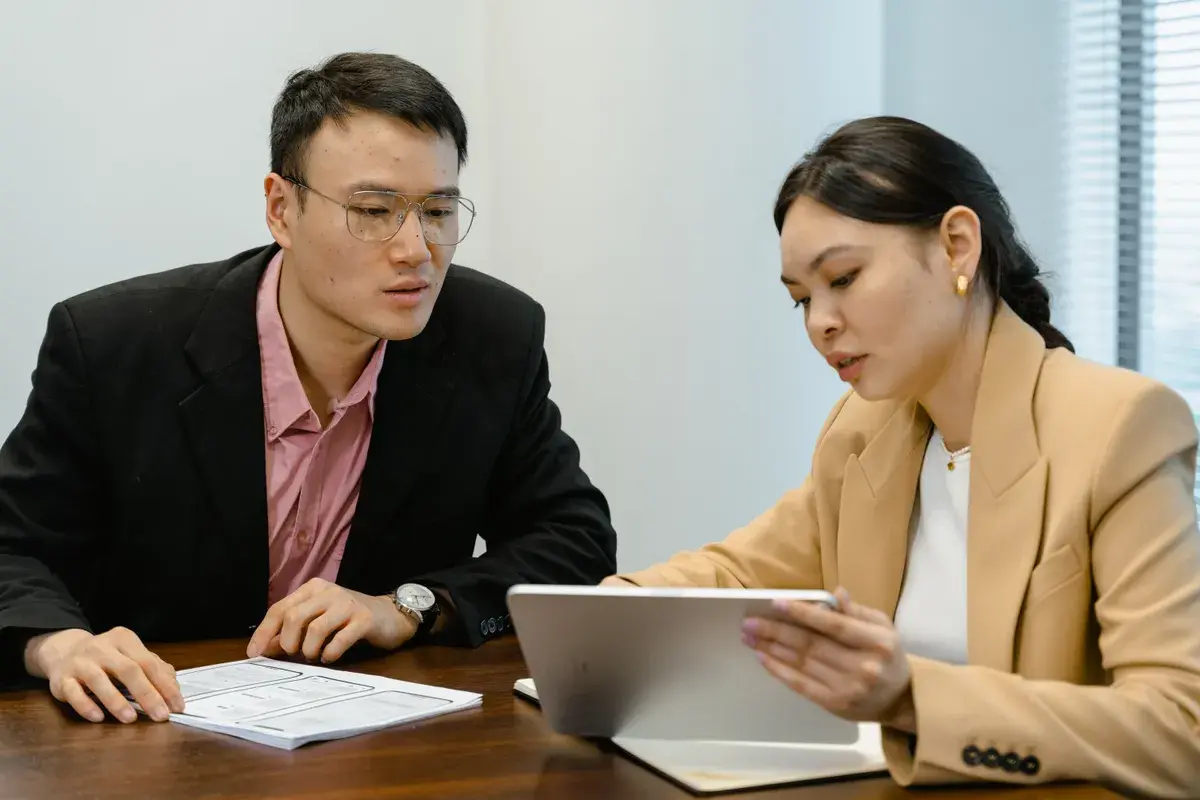 Two employees searching for an ideal advisor