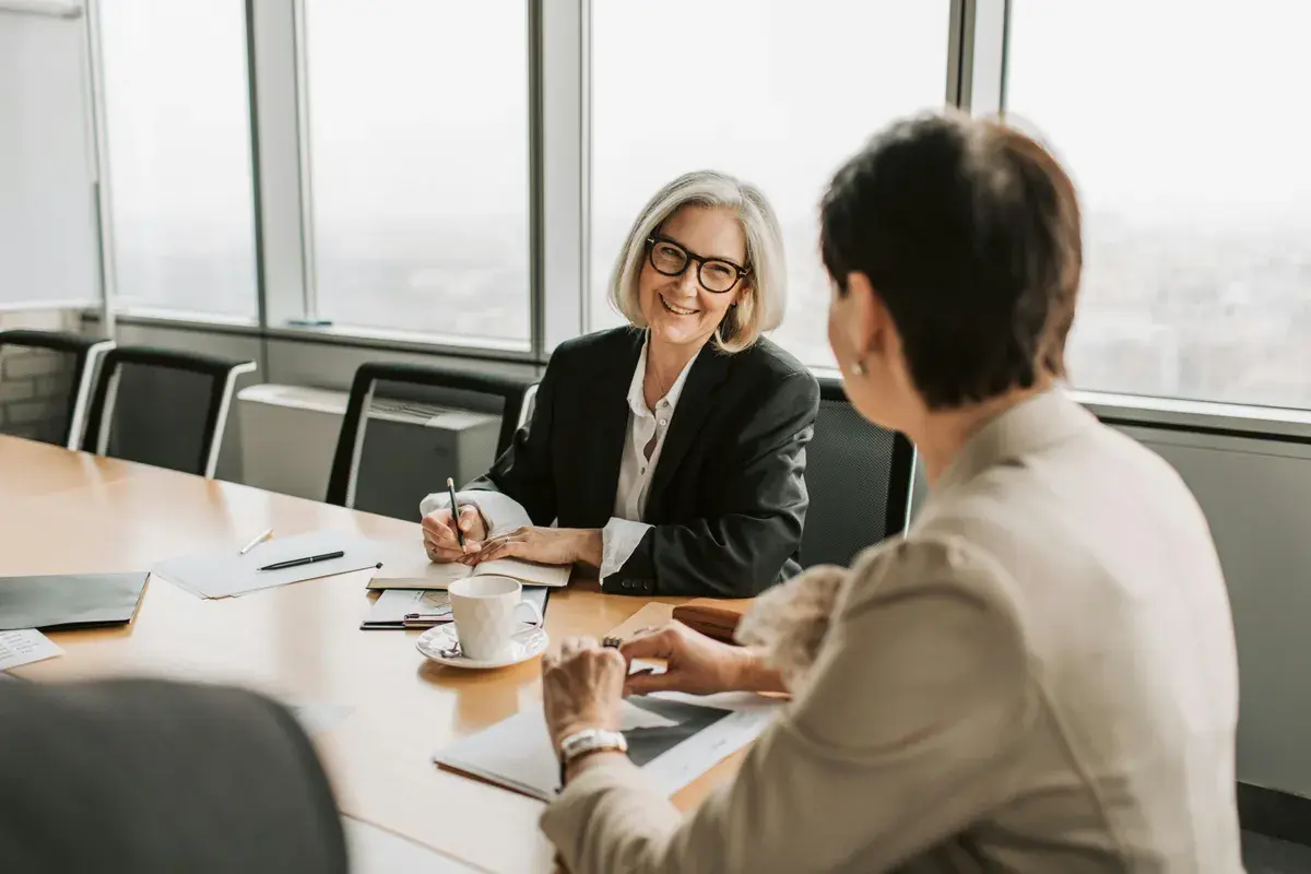 Woman sitting in the office building trust with a lender