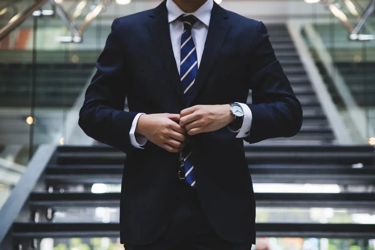 A broker standing in a bank