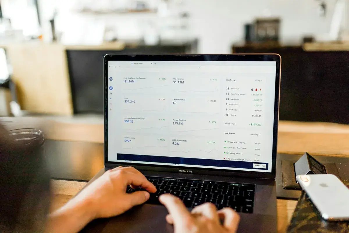 Person using macbook checking his bank account