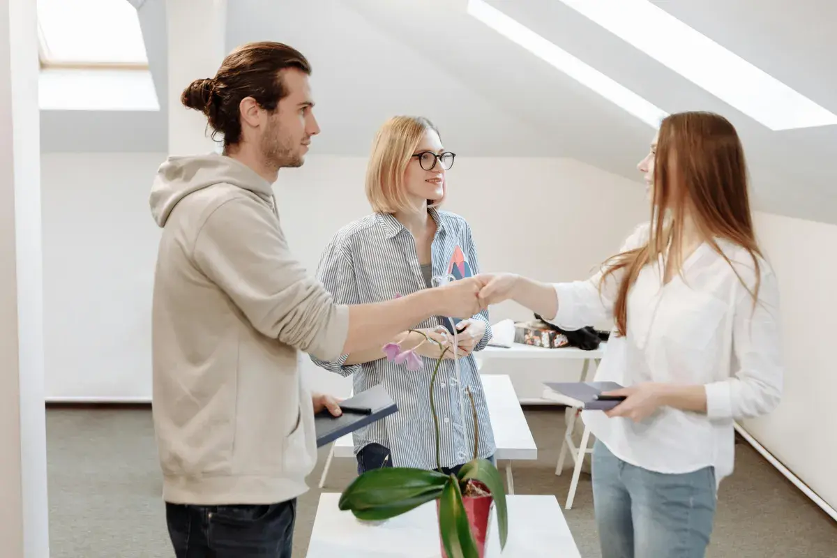 Man shaking hands with a loan officer