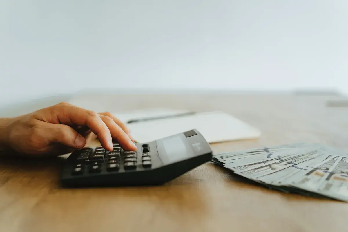 Person using calculator to count his salaries