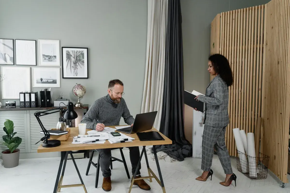 Woman in plaid blazer talking to a lender