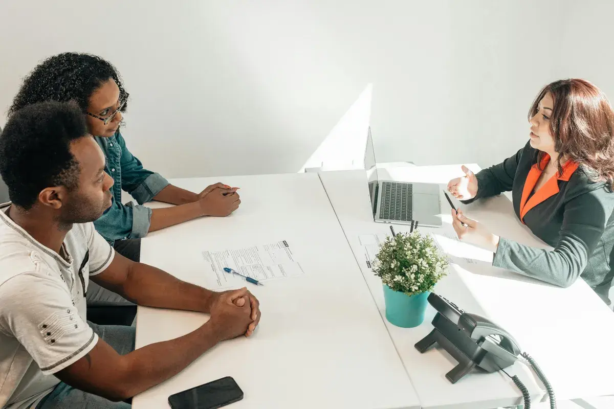 Broker discussing credit checks to clients