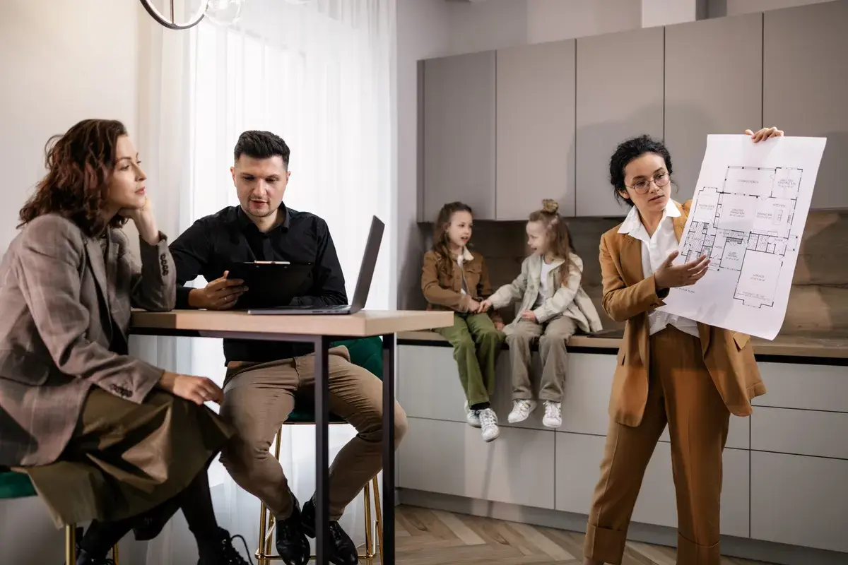 Woman explaining multiple home loans to the couple