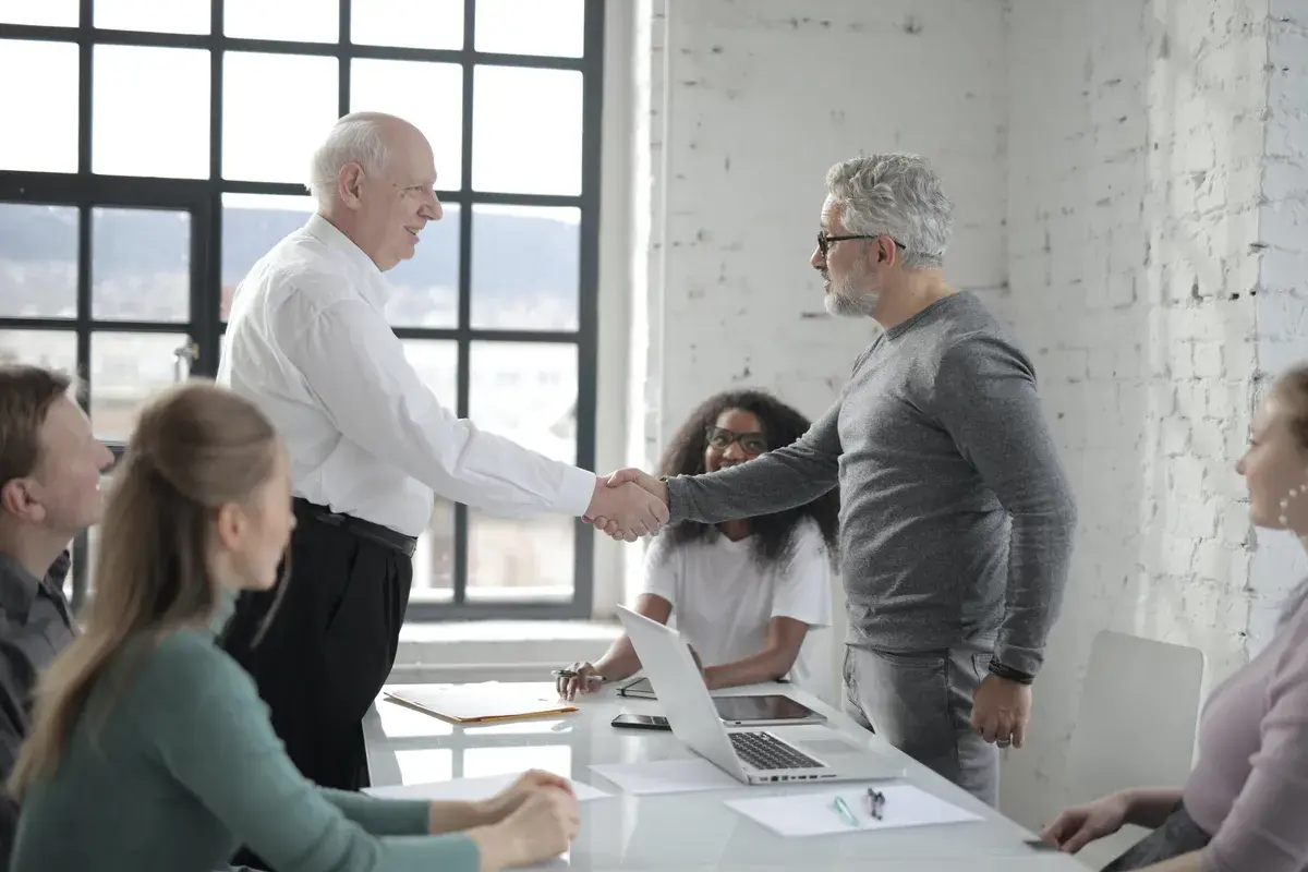 Two mortgage broker shaking hands