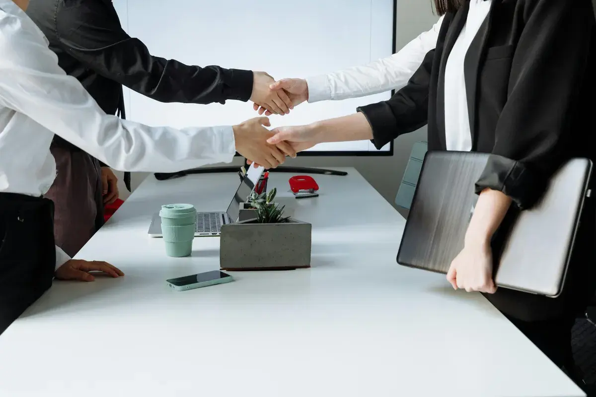 Successful mortgage brokers shaking hands