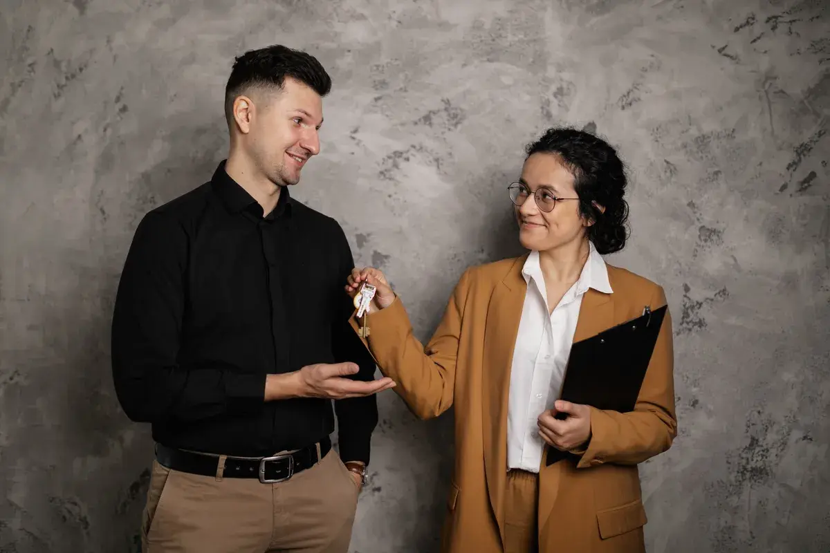 A broker congratulating a self-employed man for his first mortgage