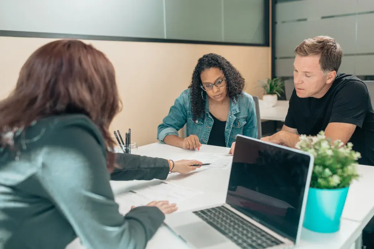 Couple consulting to a broker